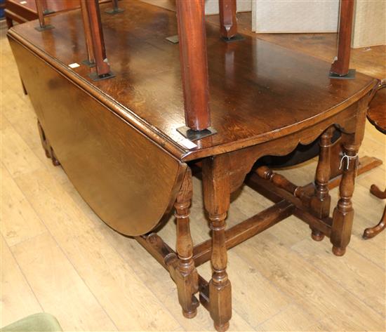 A large 18th century style oak double gateleg table, W.183cm